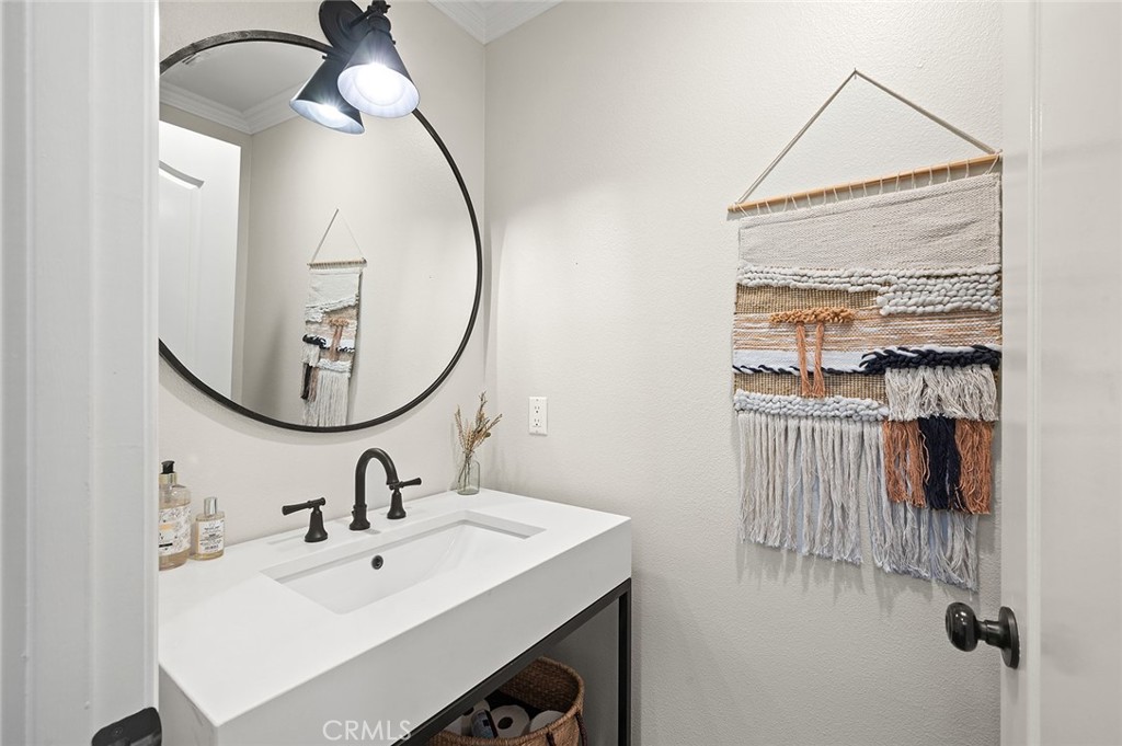 9 Baudin Circle Ladera Ranch, CA 92694 - Photo 19 of 48 a bathroom with a sink and a mirror