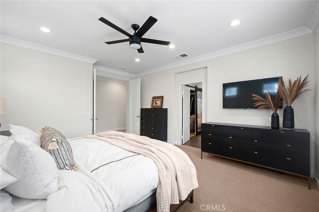 9 Baudin Circle Ladera Ranch, CA 92694 - Photo 22 of 48 a bedroom with a bed and a flat tv screen on dresser