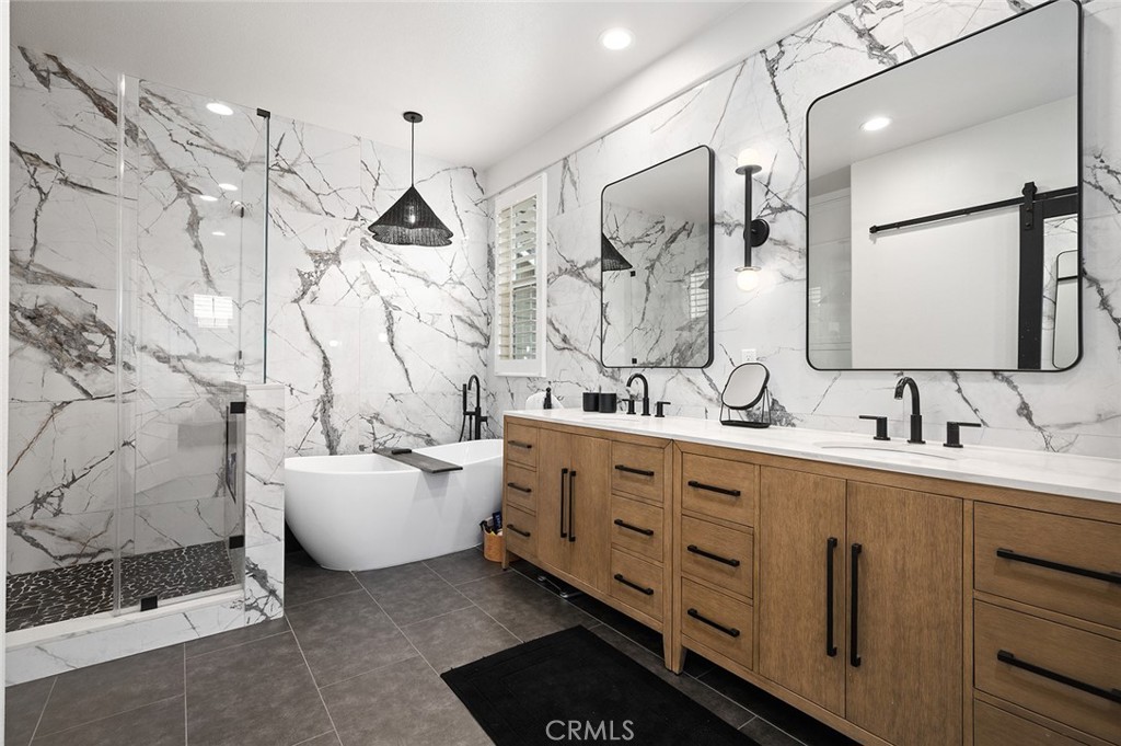 9 Baudin Circle Ladera Ranch, CA 92694 - Photo 23 of 48 a spacious bathroom with double vanity sink a mirror and a shower