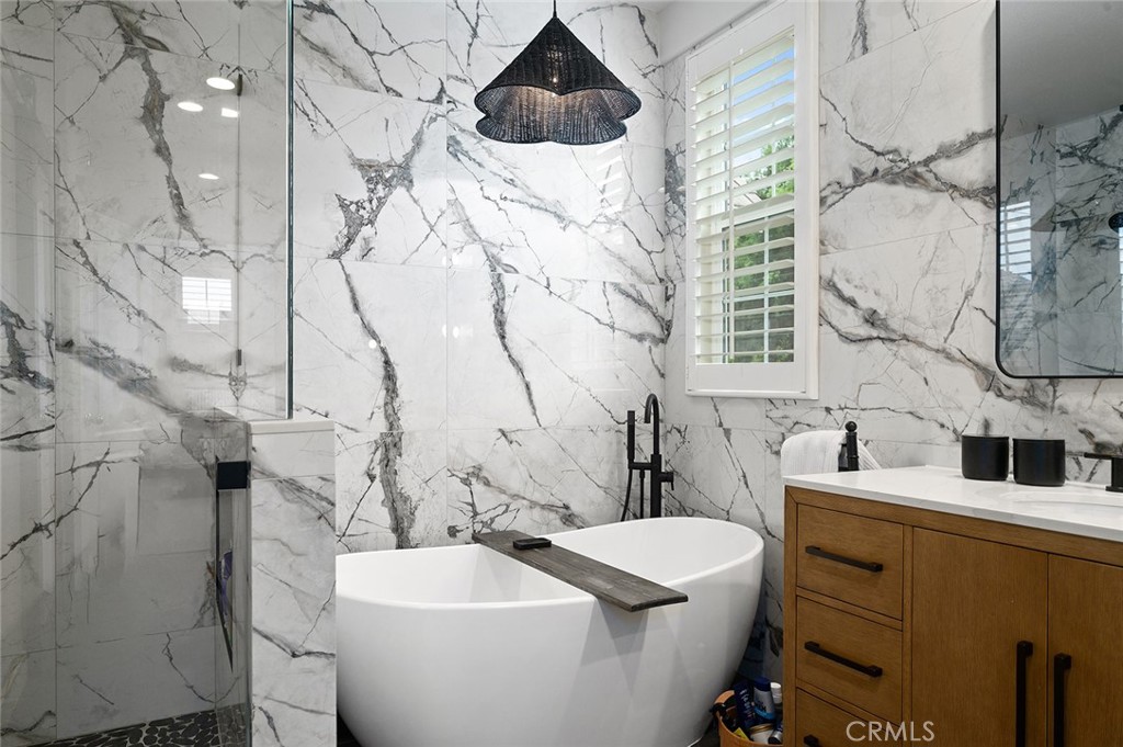 9 Baudin Circle Ladera Ranch, CA 92694 - Photo 24 of 48 a bathroom with a sink and mirror with toilet