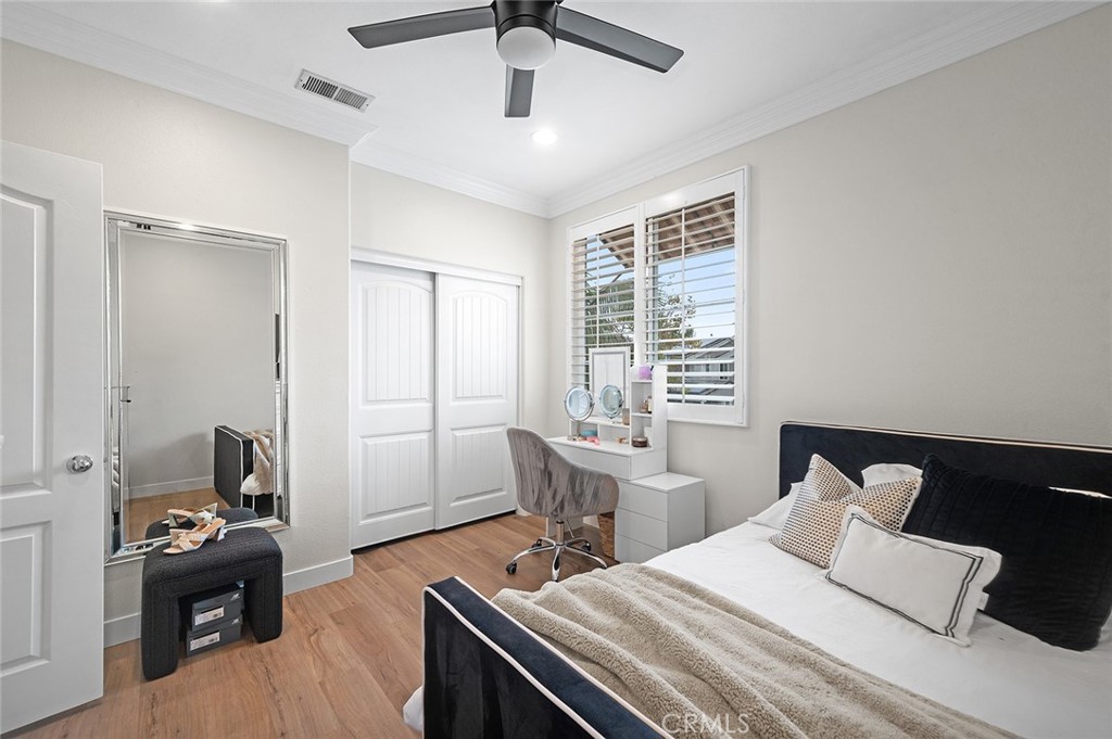 9 Baudin Circle Ladera Ranch, CA 92694 - Photo 27 of 48 a bedroom with a bed and wooden floor
