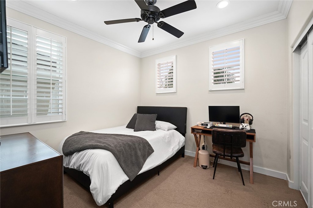 9 Baudin Circle Ladera Ranch, CA 92694 - Photo 28 of 48 a bedroom that has a bed and a desk