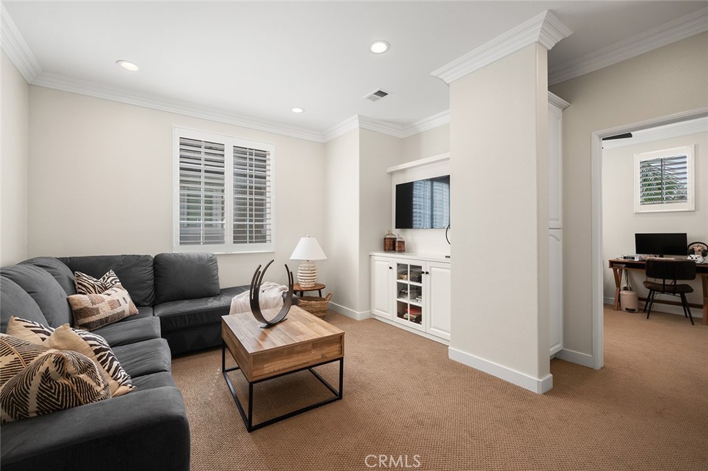 9 Baudin Circle Ladera Ranch, CA 92694 - Photo 31 of 48 a living room with furniture and a flat screen tv
