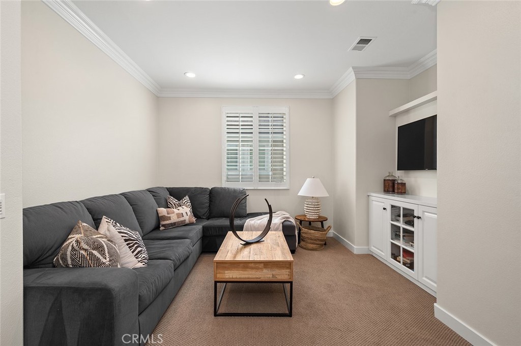 9 Baudin Circle Ladera Ranch, CA 92694 - Photo 32 of 48 a living room with furniture and a flat screen tv