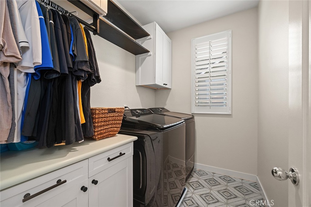 9 Baudin Circle Ladera Ranch, CA 92694 - Photo 34 of 48 a view of walk in closet with clothes and shoes
