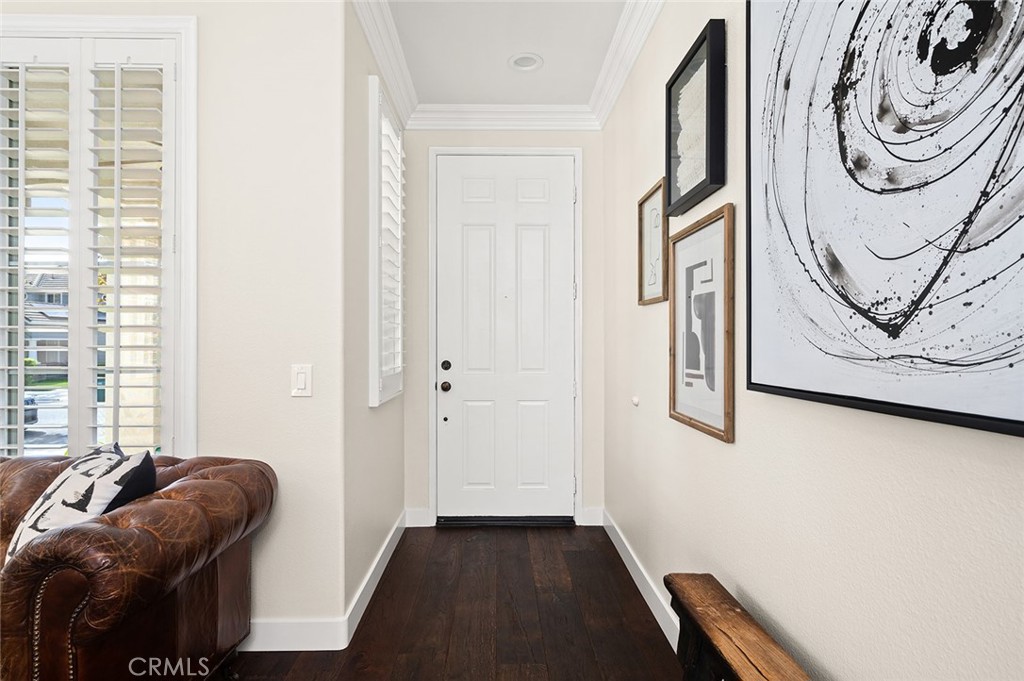 9 Baudin Circle Ladera Ranch, CA 92694 - Photo 4 of 48 a bedroom with a bed and a couch