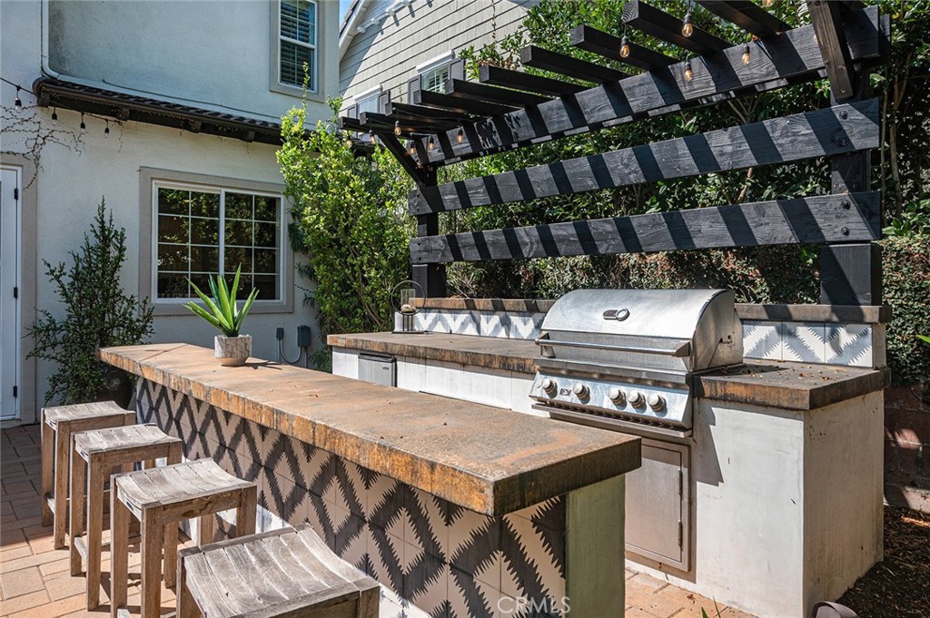 9 Baudin Circle Ladera Ranch, CA 92694 - Photo 41 of 48 a view of a chairs and table in a patio