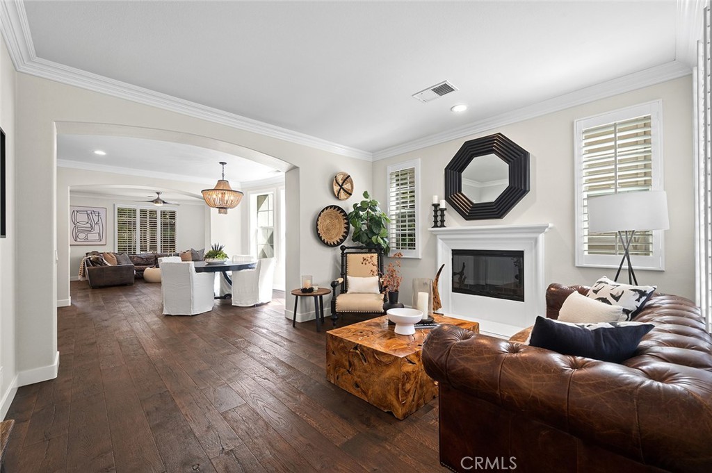 9 Baudin Circle Ladera Ranch, CA 92694 - Photo 6 of 48 a living room with furniture a fireplace and a large window