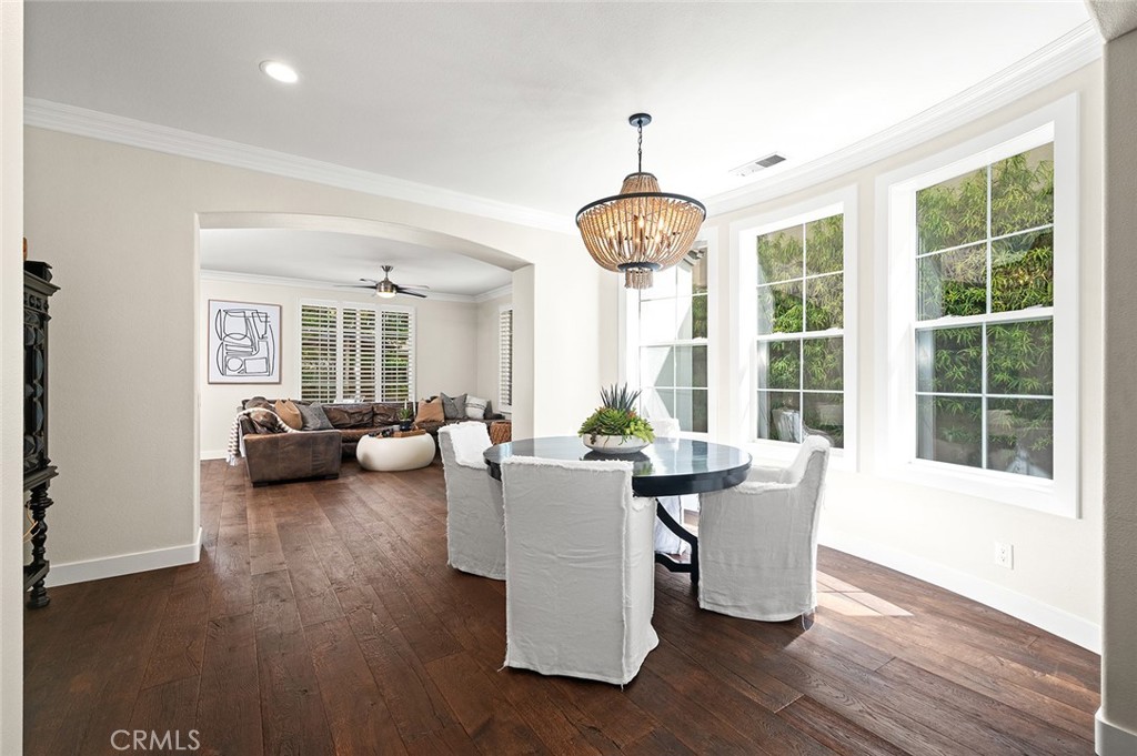 9 Baudin Circle Ladera Ranch, CA 92694 - Photo 7 of 48 a living room with furniture and a chandelier