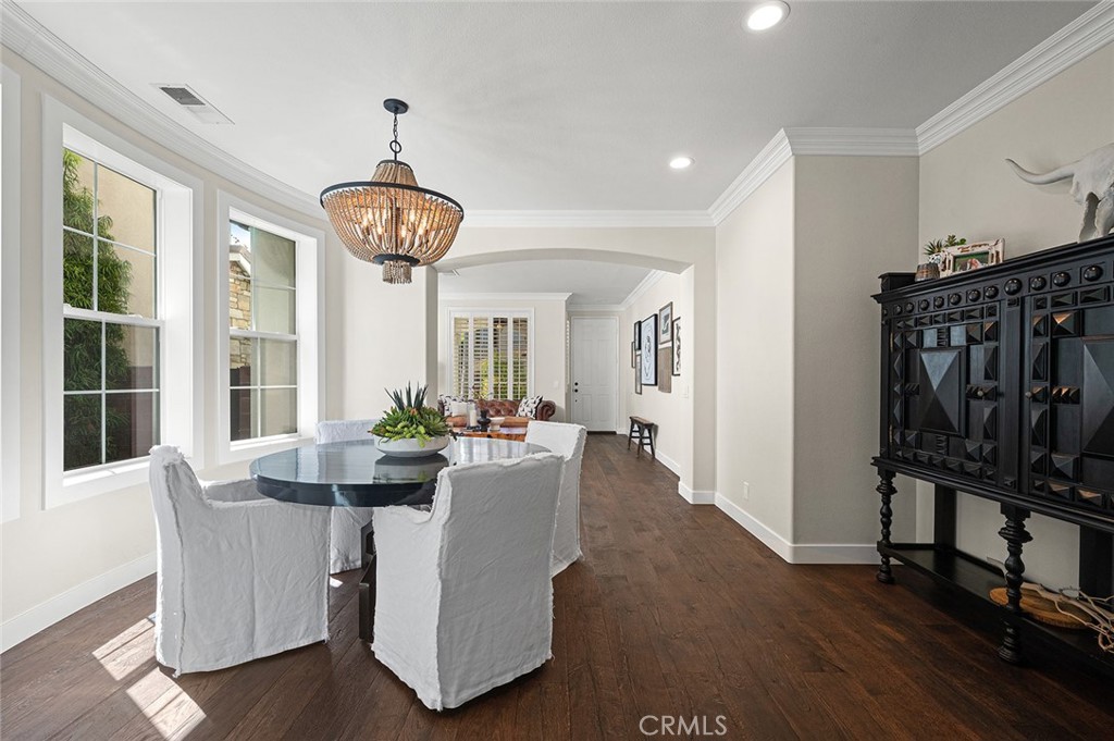9 Baudin Circle Ladera Ranch, CA 92694 - Photo 9 of 48 a view of a dining room with furniture window and wooden floor