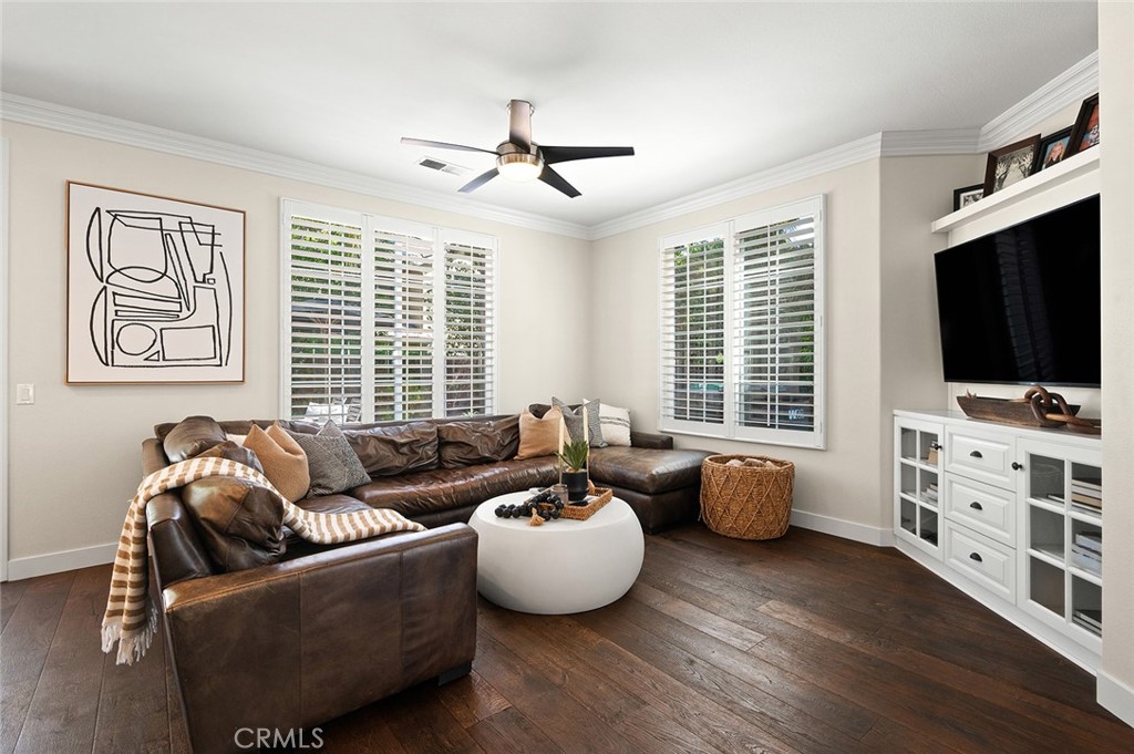 9 Baudin Circle Ladera Ranch, CA 92694 - Photo 10 of 48 a living room with furniture and a flat screen tv