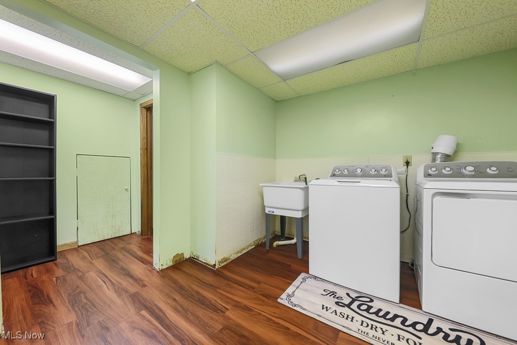 547 Lansing Road Akron, OH 44312 - Photo 45 of 50 Washroom with a drop ceiling, dark wood-type flooring, and separate washer and dryer