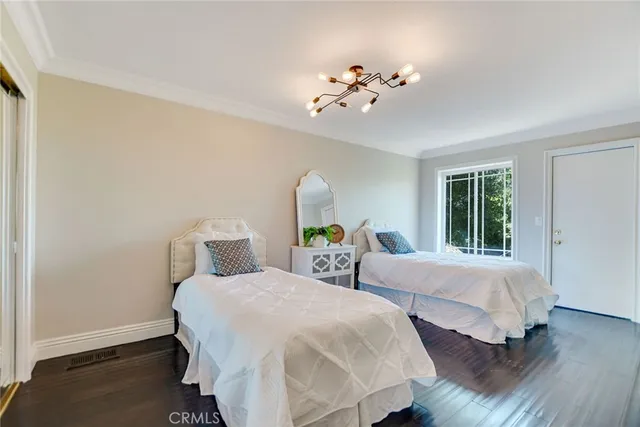 an aerial view of a house with garden space and street view