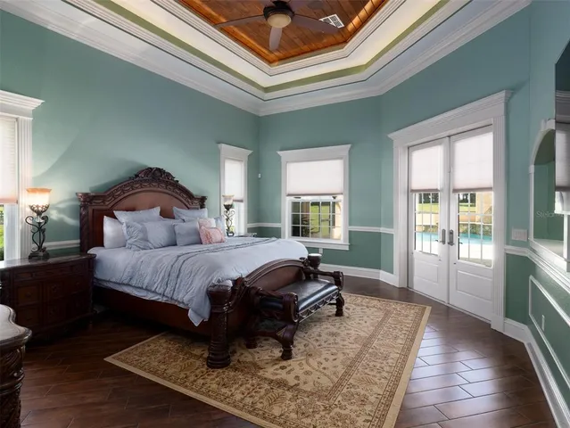 a spacious bedroom with a bed a window and walk in closet