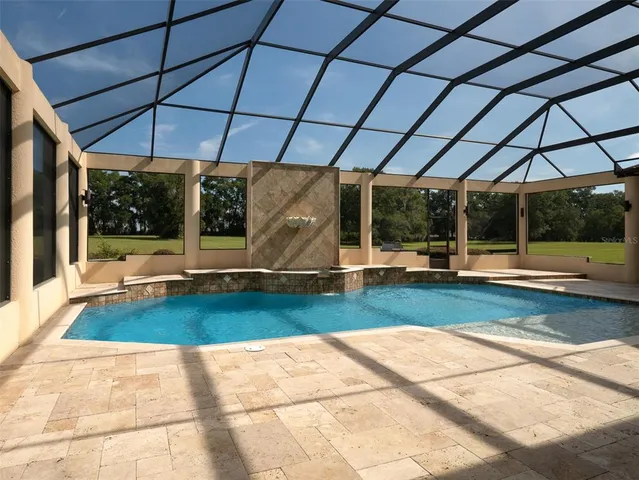 a view of swimming pool with a patio