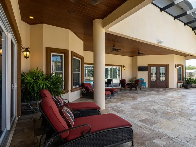a living room with furniture a window and a fireplace