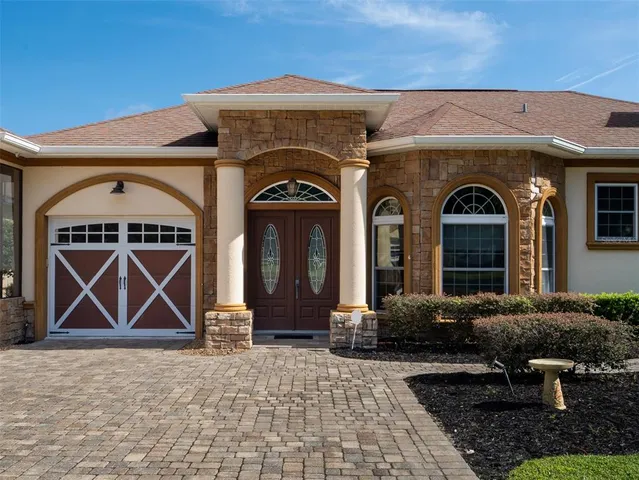 a large living room with furniture and a large window
