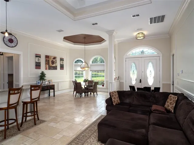 a kitchen with kitchen island granite countertop a sink and stove