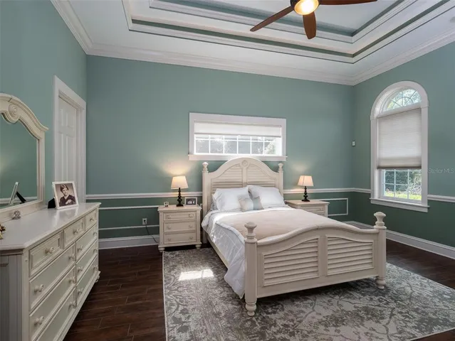 a view of swimming pool with outdoor seating and plants