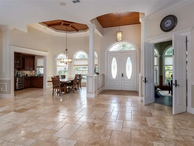 a view of a livingroom with furniture and a chandelier