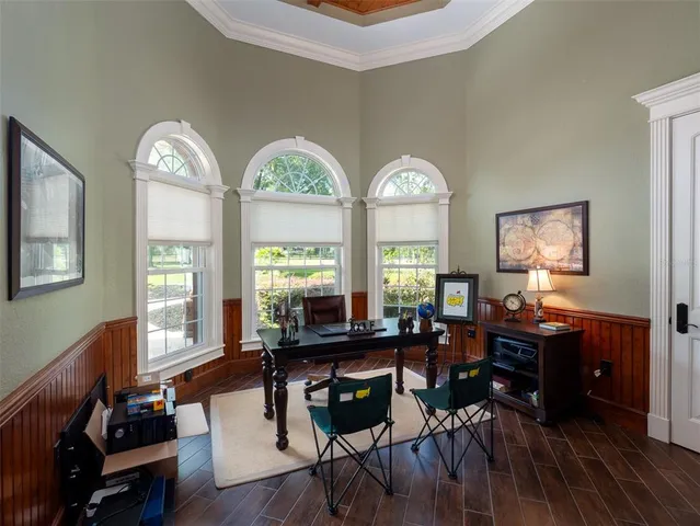 a view of a livingroom with furniture window and wooden floor