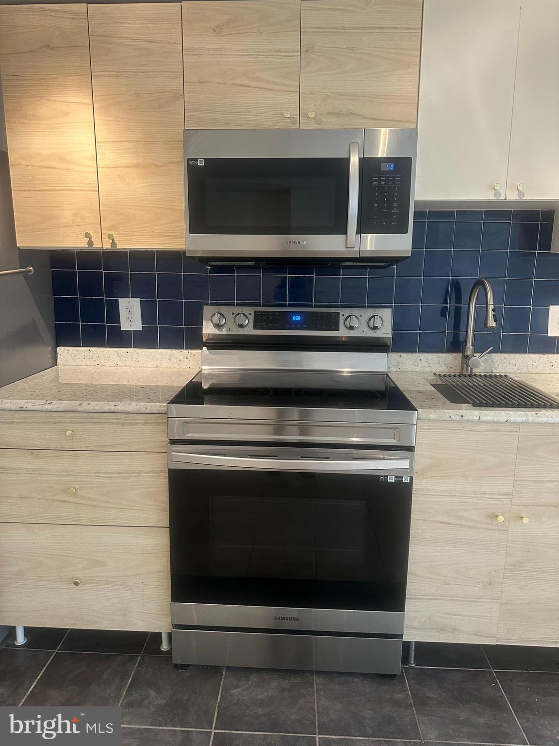 645 Q Street Northwest Washington, DC 20001 - Photo 11 of 31 a stove top oven sitting inside of a kitchen