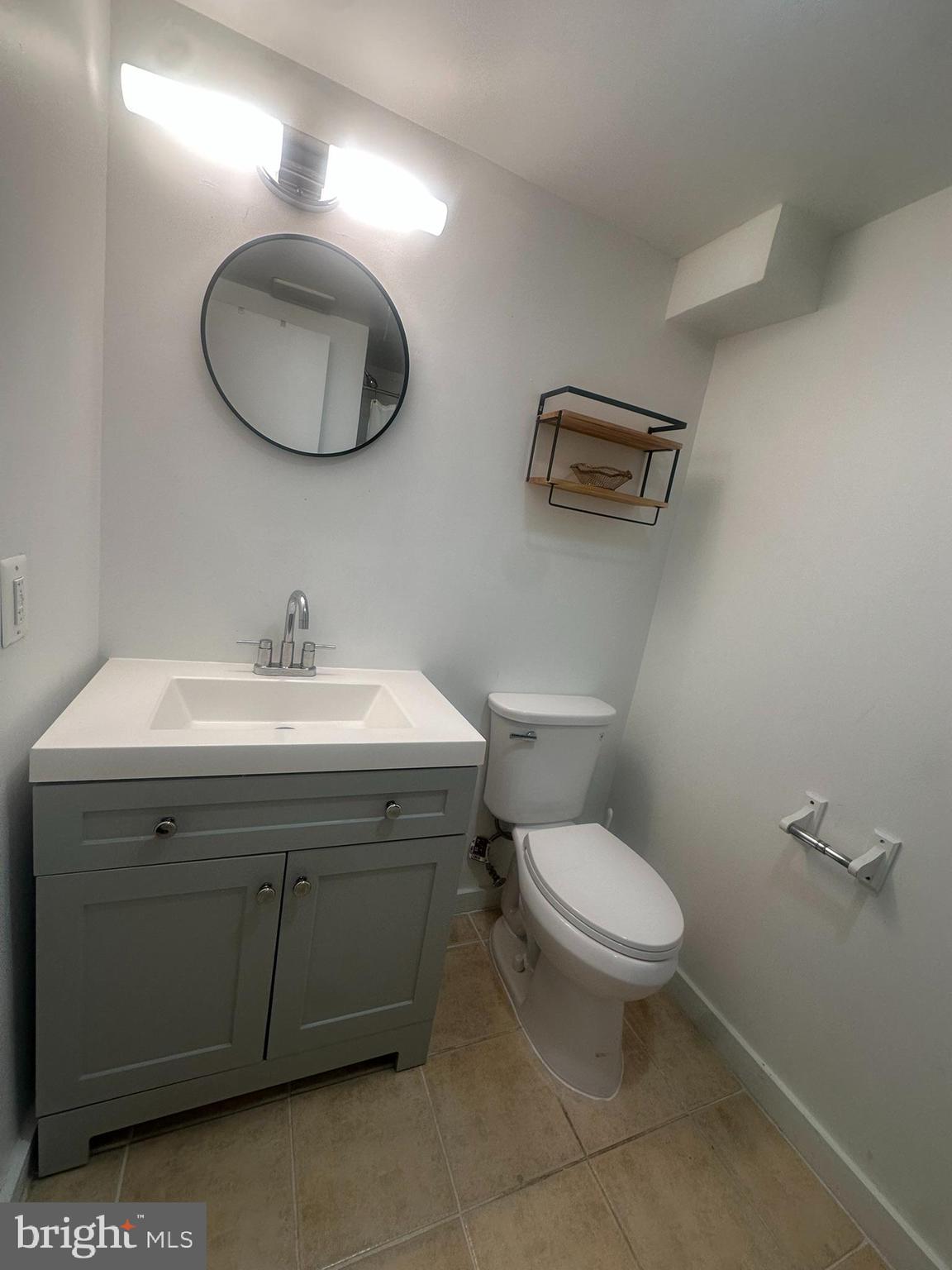 645 Q Street Northwest Washington, DC 20001 - Photo 19 of 31 a bathroom with a toilet a sink and mirror