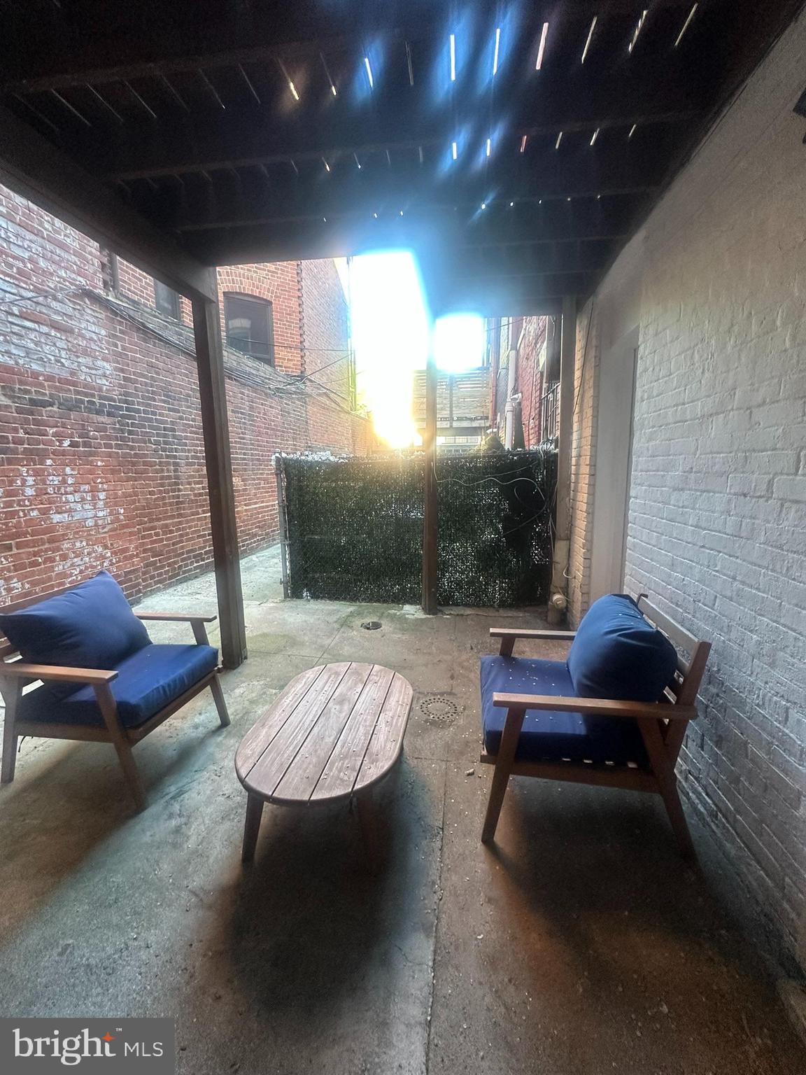 645 Q Street Northwest Washington, DC 20001 - Photo 27 of 31 a living room with furniture a rug and a large window