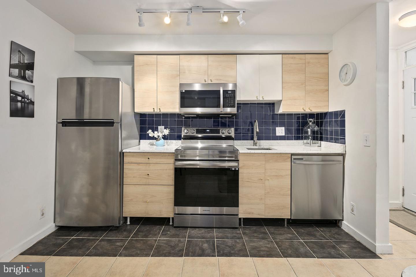 645 Q Street Northwest Washington, DC 20001 - Photo 4 of 31 a kitchen with a stove a sink and a refrigerator