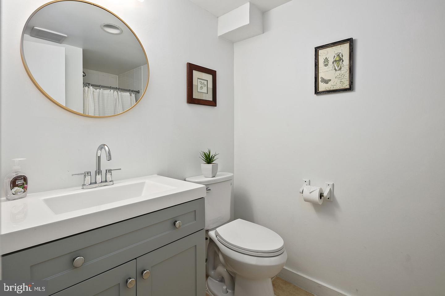 645 Q Street Northwest Washington, DC 20001 - Photo 5 of 31 a bathroom with a toilet a sink and mirror