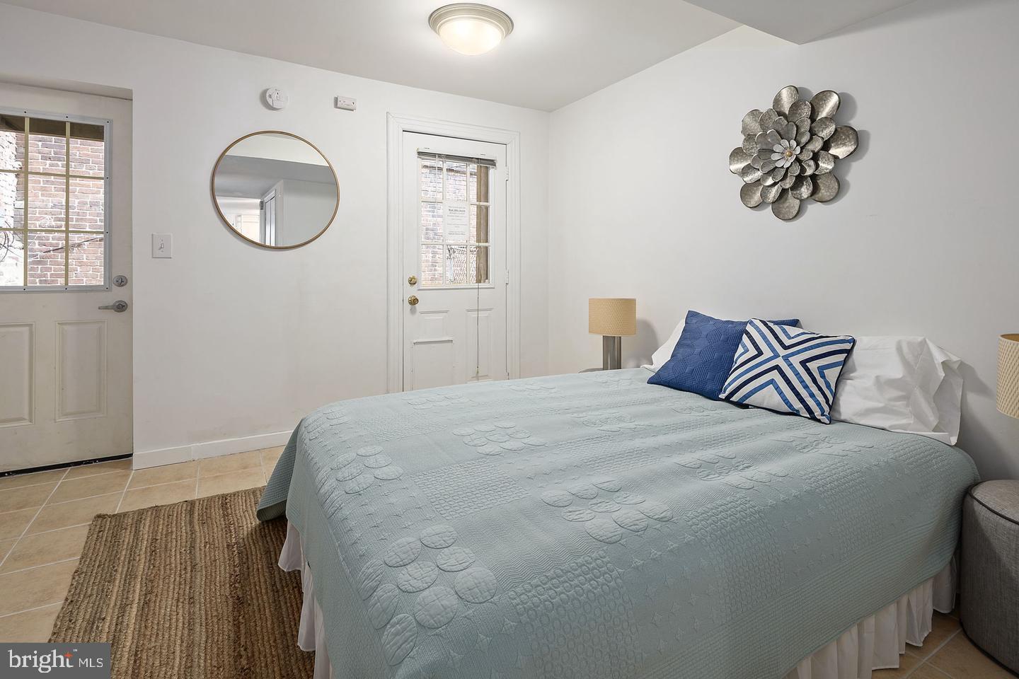 645 Q Street Northwest Washington, DC 20001 - Photo 6 of 31 a bedroom with a bed and a window