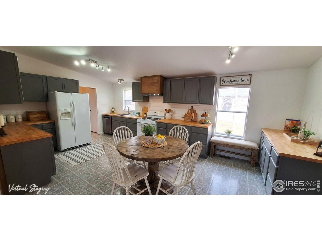 a kitchen with refrigerator and window