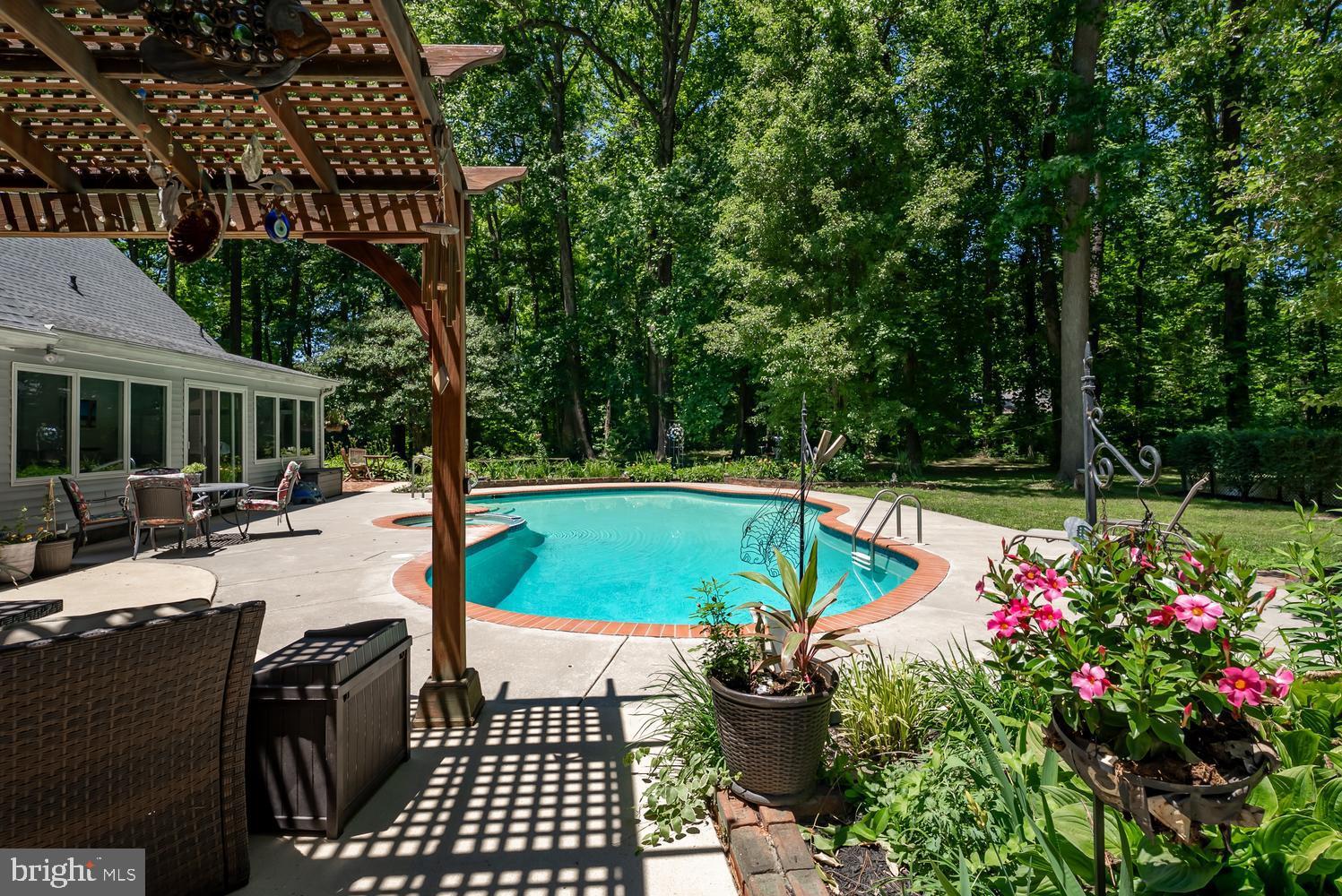 814 Wrights Neck Road Centreville, MD 21617 - Photo 14 of 53 an outdoor space with swimming pool and furniture