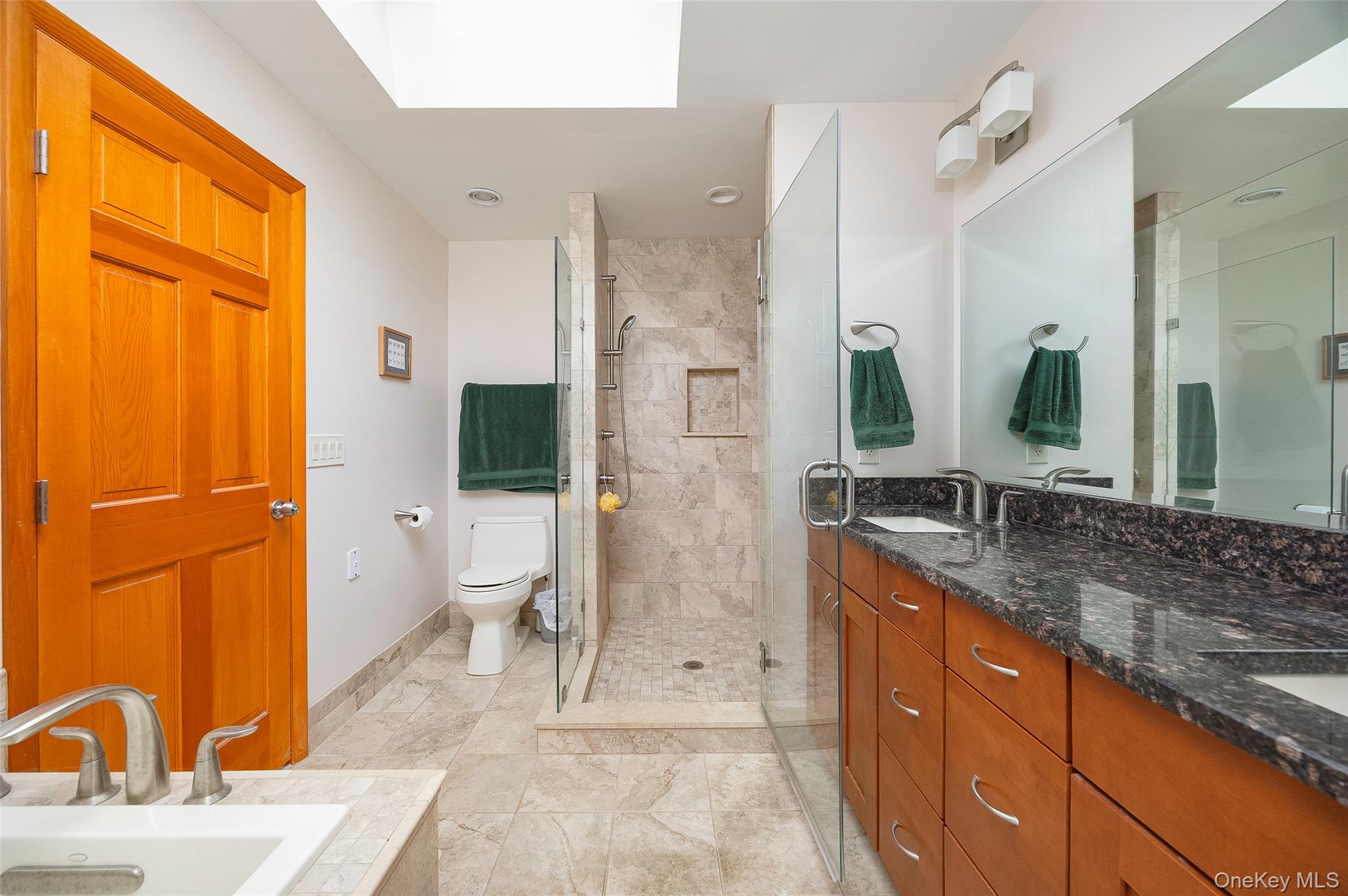 2 English Way Pleasant Valley, NY 12569 - Photo 17 of 32 a spacious bathroom with a granite countertop sink mirror and a bathtub