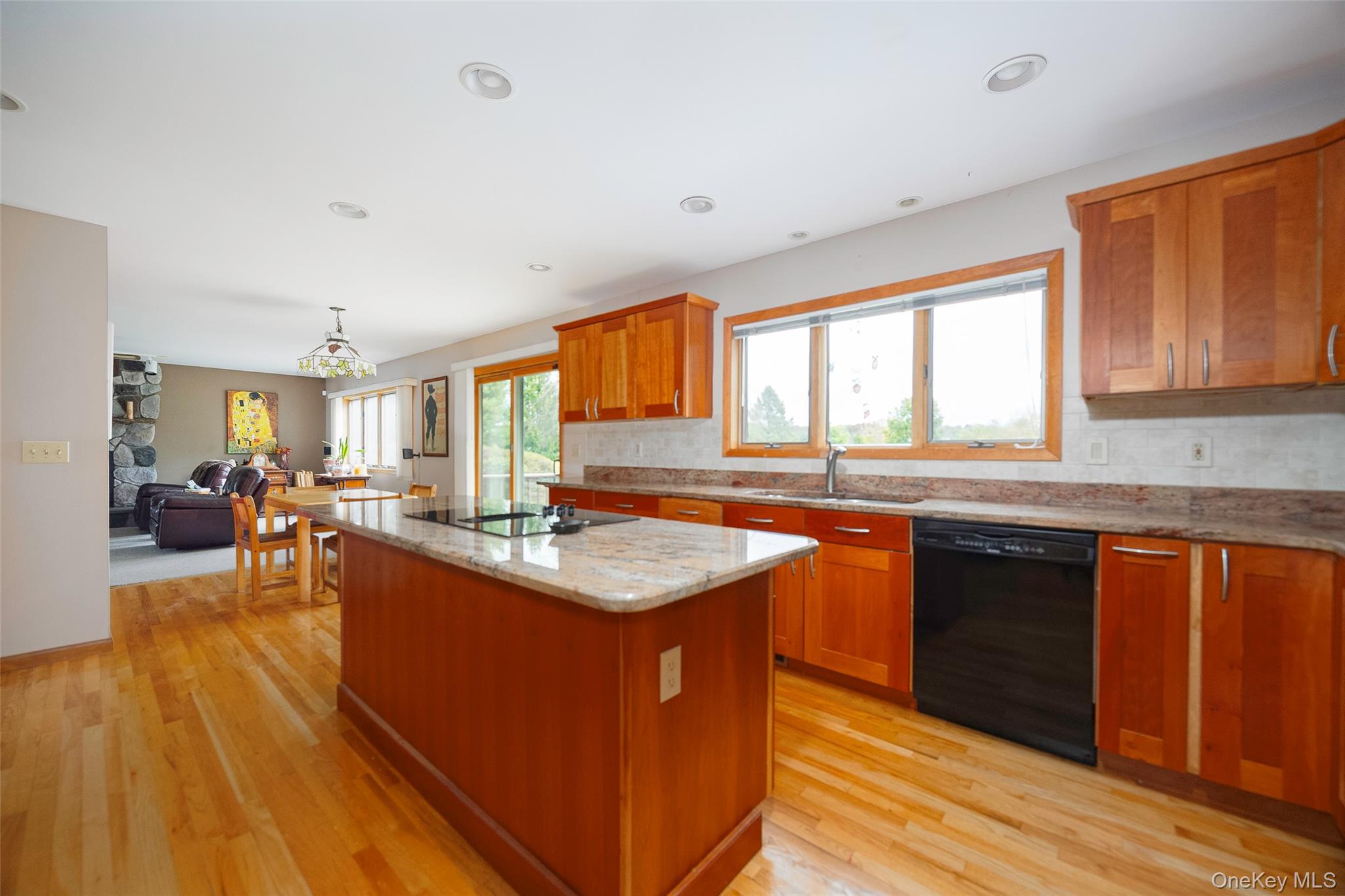 2 English Way Pleasant Valley, NY 12569 - Photo 4 of 32 a kitchen with stainless steel appliances granite countertop a sink stove and wooden cabinets