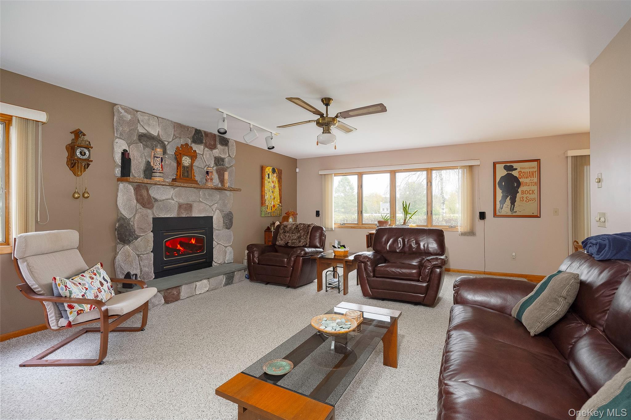 2 English Way Pleasant Valley, NY 12569 - Photo 5 of 32 a living room with furniture a fireplace and a large window