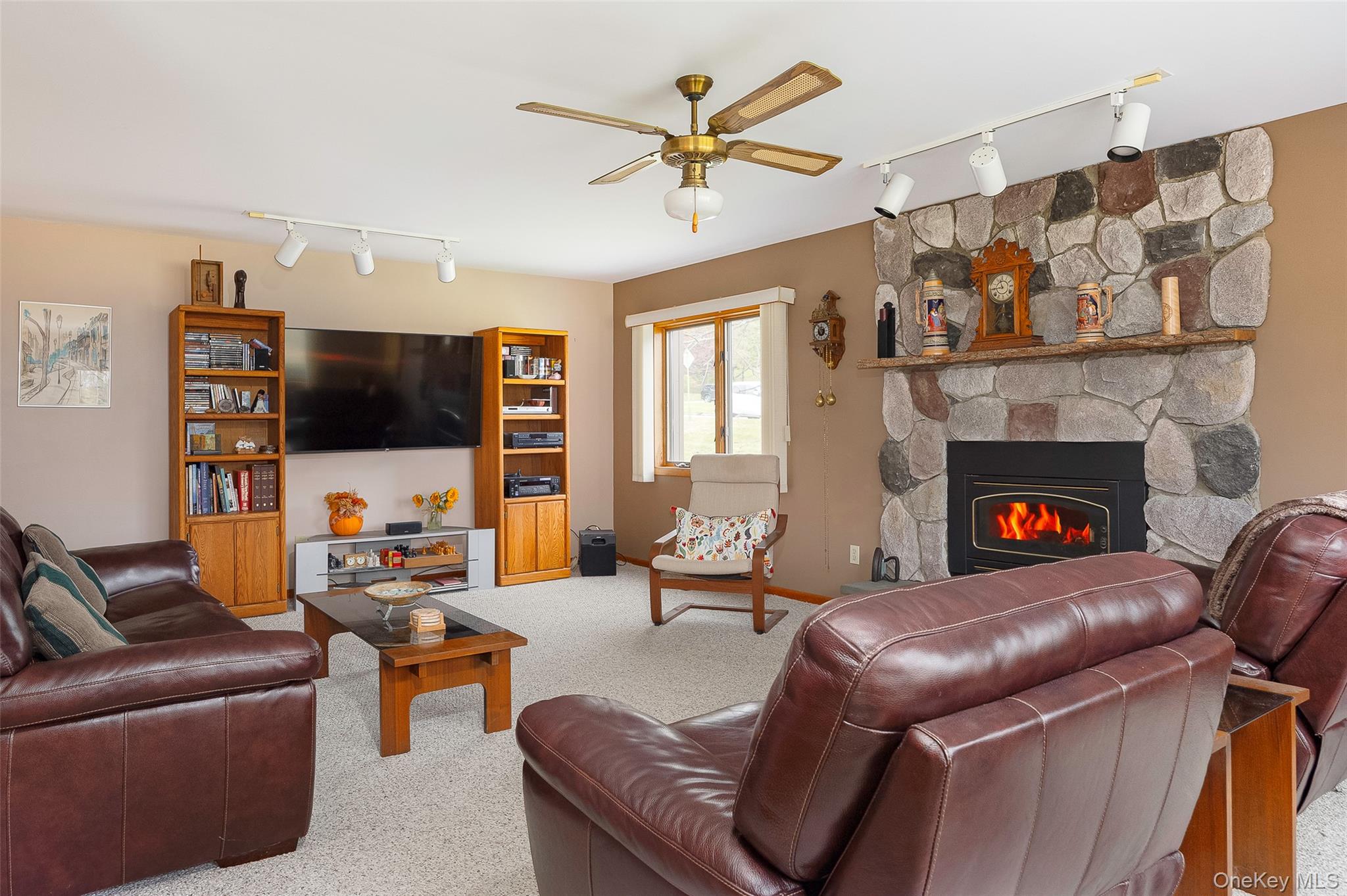 2 English Way Pleasant Valley, NY 12569 - Photo 6 of 32 a living room with furniture a flat screen tv and a fireplace