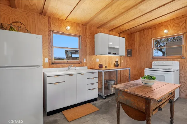 a kitchen that has a cabinets and a stove