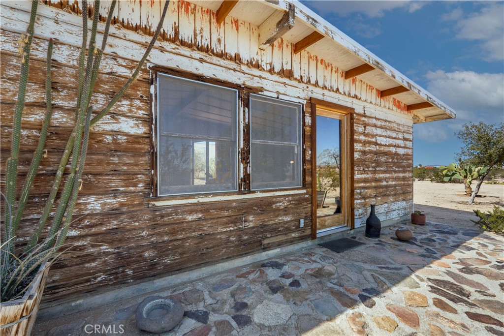 1356 Enchanted Road Joshua Tree, CA 92252 - Photo 2 of 47 a front view of a house