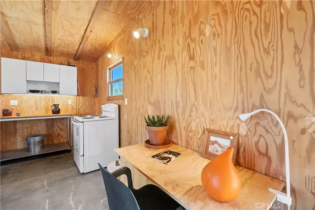 a kitchen with a sink appliances and cabinets