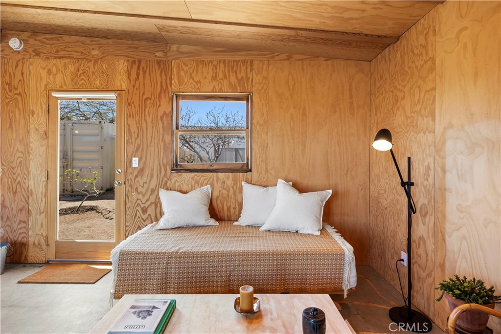 1356 Enchanted Road Joshua Tree, CA 92252 - Photo 24 of 47 a bedroom with a bed and a window