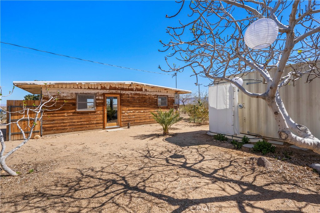 1356 Enchanted Road Joshua Tree, CA 92252 - Photo 26 of 47 a view of a backyard of the house