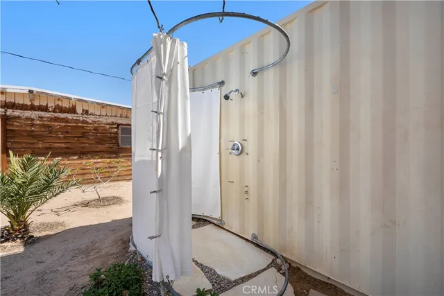 a bathroom with a shower and a sink
