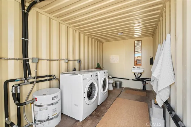 a view of a storage & utility room with washer and dryer