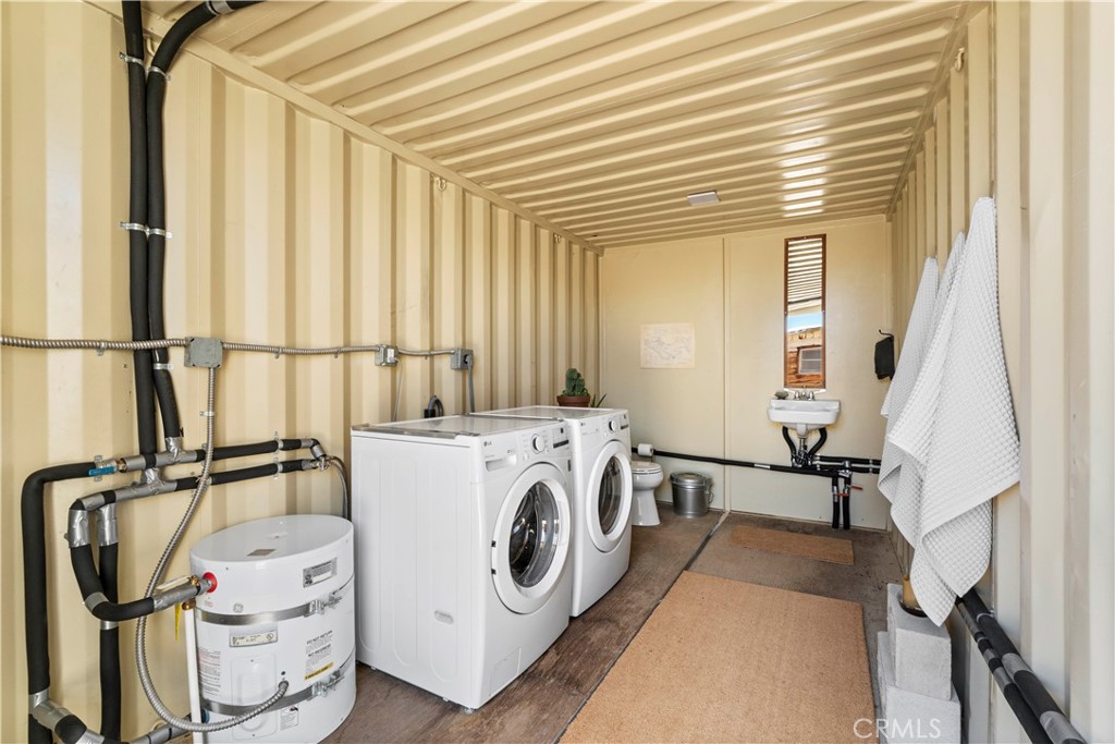 1356 Enchanted Road Joshua Tree, CA 92252 - Photo 28 of 47 a view of a storage & utility room with washer and dryer