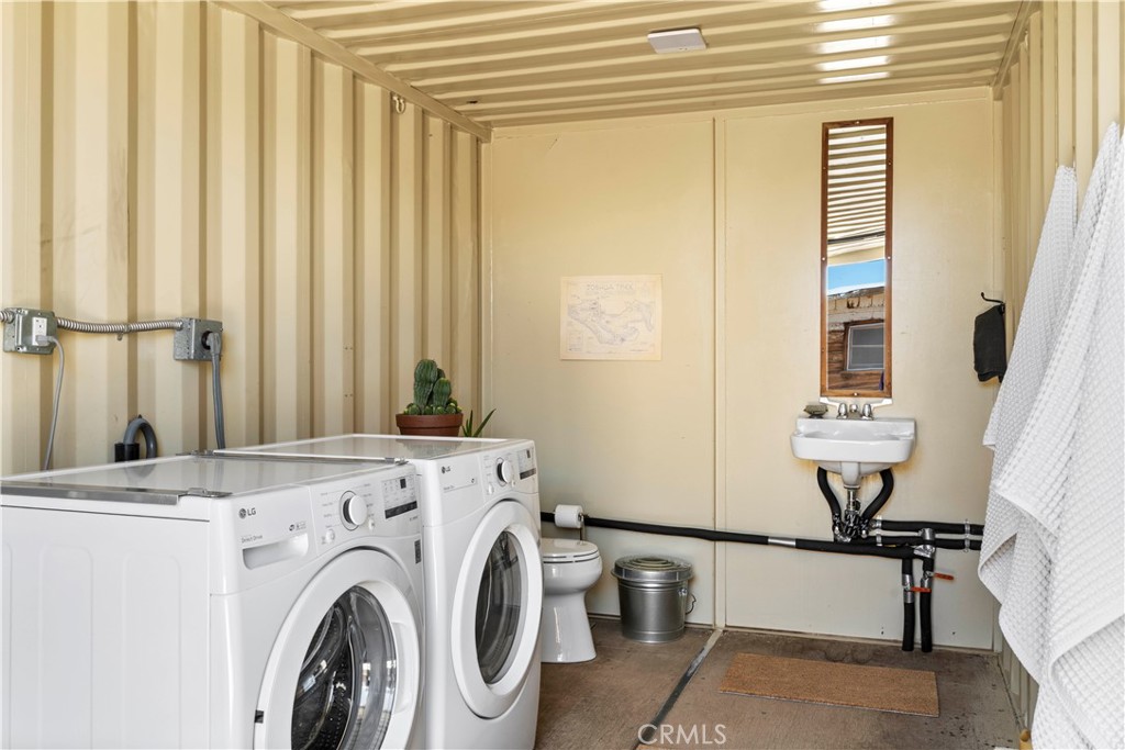 1356 Enchanted Road Joshua Tree, CA 92252 - Photo 29 of 47 a view of washer and dryer next to window
