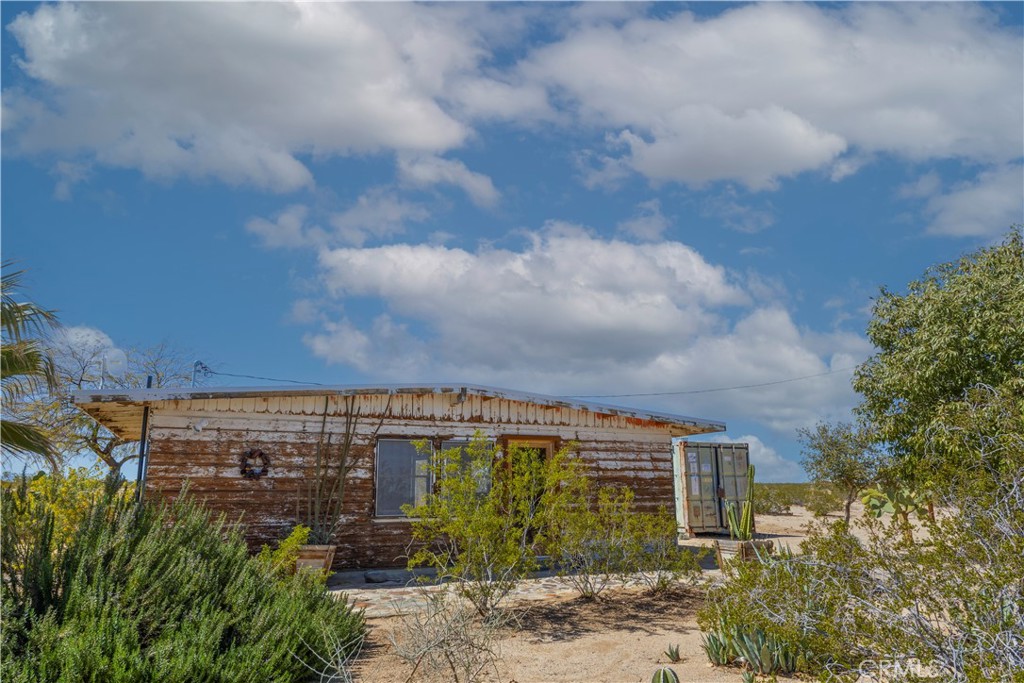 1356 Enchanted Road Joshua Tree, CA 92252 - Photo 3 of 47 a front view of a house
