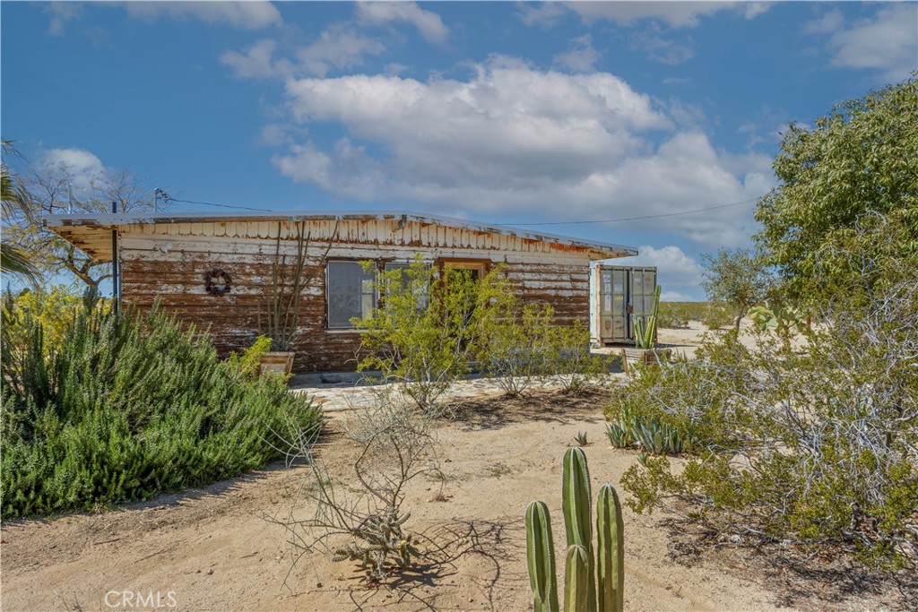 1356 Enchanted Road Joshua Tree, CA 92252 - Photo 4 of 47 a view of a pathway both side of house