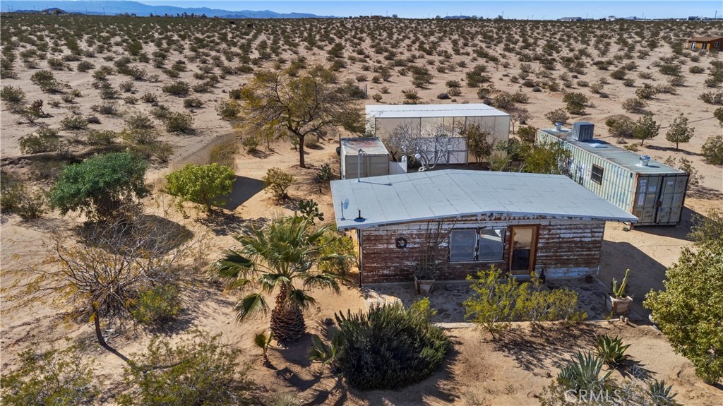 1356 Enchanted Road Joshua Tree, CA 92252 - Photo 46 of 47 an aerial view of a house with a yard