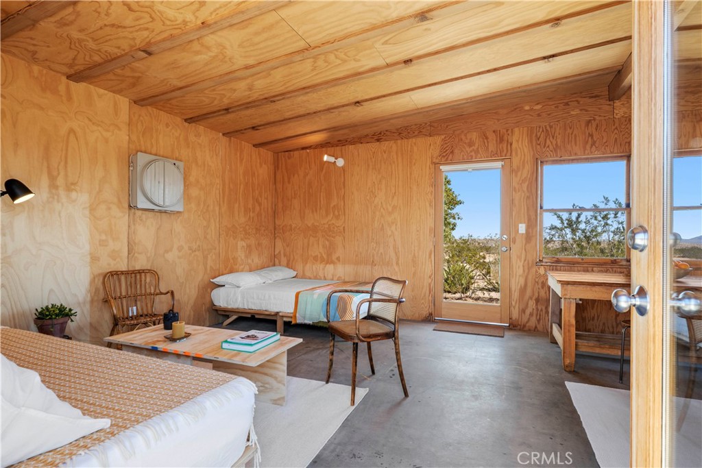 1356 Enchanted Road Joshua Tree, CA 92252 - Photo 7 of 47 a living room with a couch and a table